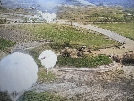 Toyohara Airfield under US parafrag attack, Taichu (now Taichung), Taiwan, 1945, photo 2 of 2 [Colorized by WW2DB]