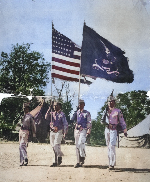 Soldiers of US Army 1st Filipino Infantry Regiment bearing flags on the parade ground, date unknown [Colorized by WW2DB]