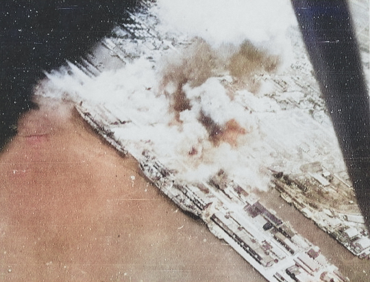 Takao (now Kaohsiung) harbor, Taiwan under US Navy carrier aircraft attack, 12 Oct 1944, photo 2 of 6 [Colorized by WW2DB]