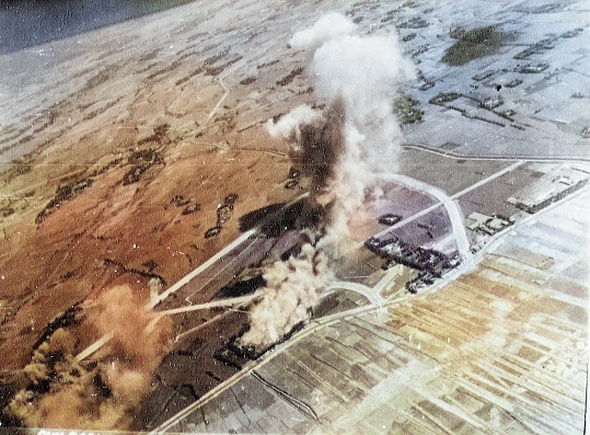 Shoka Airfield in Shoka (now Changhua), Taiwan under US Navy carrier aircraft attack, 12 Oct 1944, photo 1 of 2 [Colorized by WW2DB]