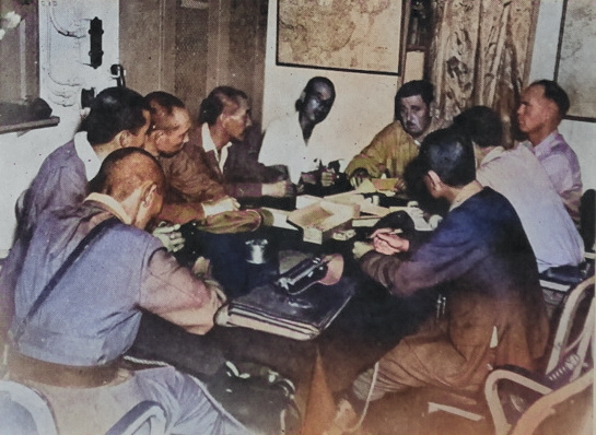 USMC Colonel A. D. Cooley conferring with Japanese officers over the liberation of US prisoners of war, Taiwan, 5 Sep 1945 [Colorized by WW2DB]