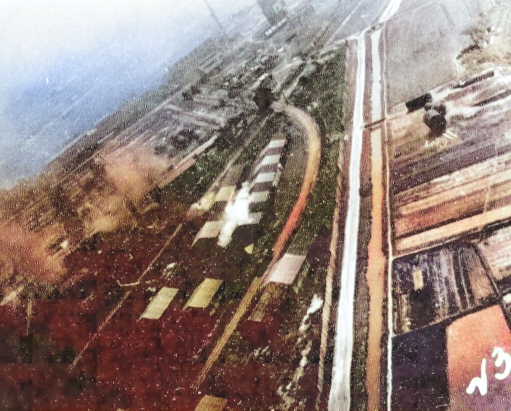 Kagi butanol plant under attack by PV-1 aircraft of US Navy squadron VPB-137, Kagi (now Chiayi), Taiwan, 3 Apr 1945, photo 1 of 2 [Colorized by WW2DB]