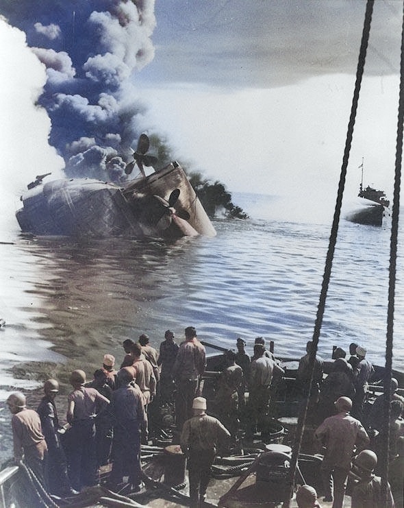 Sinking of oiler USS Mississinewa after being struck by a Kaiten in Ulithi anchorage, Caroline Islands, 20 Nov 1944; photograph taken from fleet ocean tug USS Munsee [Colorized by WW2DB]