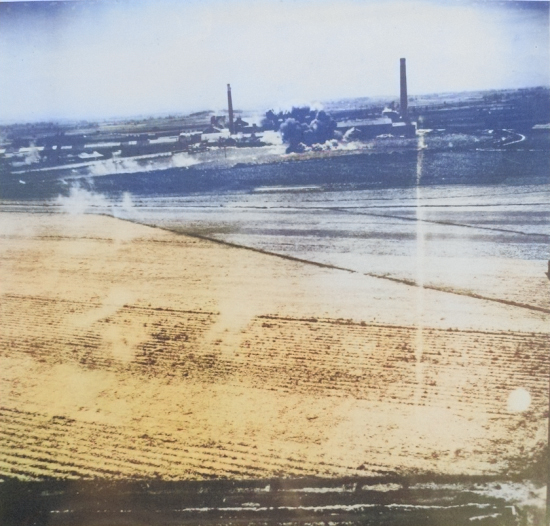 Nansei sugar plant under US air attack, Kagi (now Chiayi), Taiwan, 24 Apr 1945, photo 3 of 3 [Colorized by WW2DB]