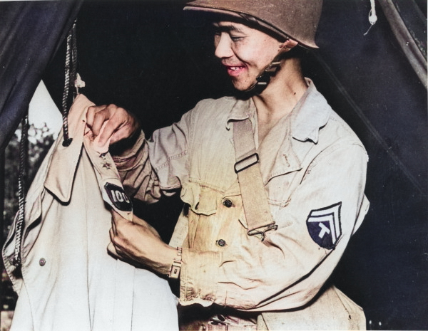 Japanese-American recruit of US 100th Infantry Battalion, an orderly for a general, preparing an uniform while training at Camp Shelby, Mississippi, United States, 1943 [Colorized by WW2DB]