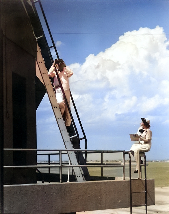 A US Navy Sailor and a WAVES personnel on duty as control tower spotters at Naval Air Station, Norfolk, Virginia, United States, circa 1944-1945 [Colorized by WW2DB]