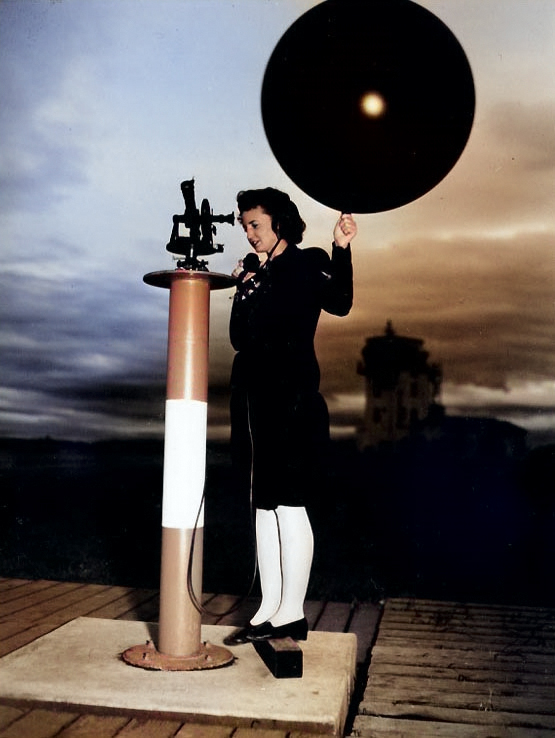 WAVES Aerographer's Mate 3rd Class Dorothy J. Baroch launching a weather balloon rom a theodolite platform, Naval Air Station, Moffett Field, California, United States, circa 1944-1945 [Colorized by WW2DB]