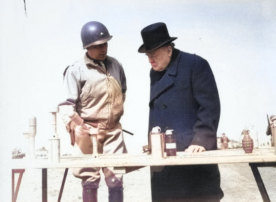 Winston Churchill being shown various weapons, England, United Kingdom, 15 May 1944, photo 2 of 2 [Colorized by WW2DB]