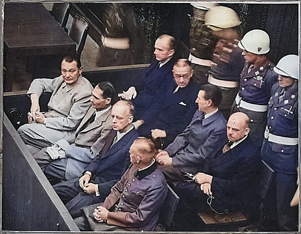 Hermann Göring, Rudolf Heß, Joachim von Ribbentrop, Wilhelm Keitel, Karl Dönitz, Erich Raeder, Baldur von Schirach, and Fritz Sauckel at the Nuremberg Trials, Germany, 7 Feb 1946, photo 2 of 2 [Colorized by WW2DB]