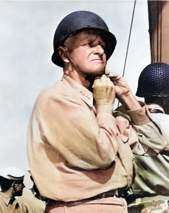 US Admiral Chester Nimitz Chester putting on a steel helmet aboard an American warship, circa 1944 [Colorized by WW2DB]