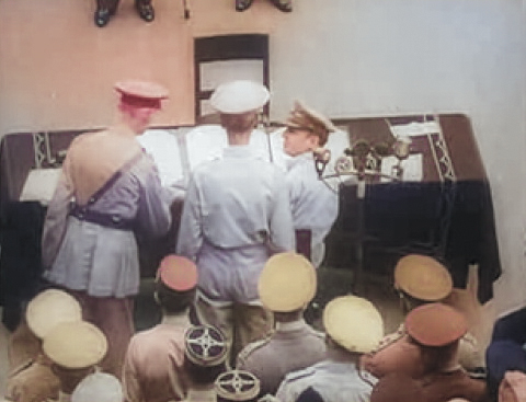 Douglas MacArthur giving a pen to Arthur Percival to sign the Japanese surrender document, aboard USS Missouri, Tokyo Bay, Japan, 2 Sep 1945 [Colorized by WW2DB]