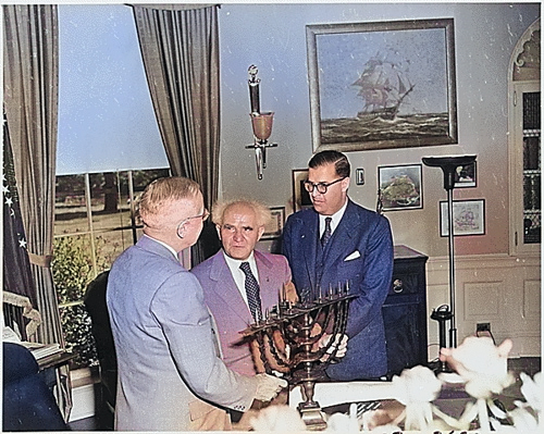 Israeli Prime Minister David Ben-Gurion presenting US President Harry Truman with a Menorah, White House, Washington DC, United States, 8 May 1951; Israeli Ambassador to US Abba Eban also present [Colorized by WW2DB]