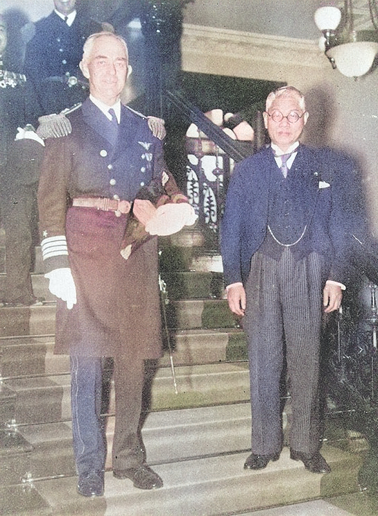 US Navy Captain Richmond Turner and Japanese Foreign Minister Hachiro Arita at Arita's official residence, Tokyo, Japan, Apr 1939 [Colorized by WW2DB]