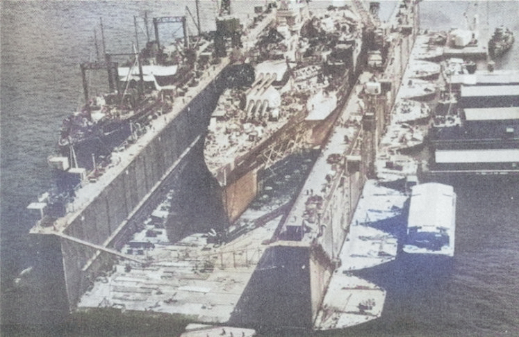 USS ABSD-1 with USS California in the dock, Espiritu Santo, New Hebrides, circa 8 Sep 1944 [Colorized by WW2DB]