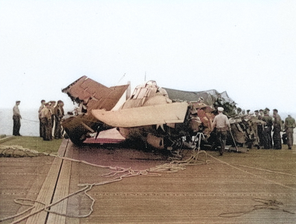 FM-1 aircraft having crashed into several TBF aircraft while landing on the flight deck of USS Coral Sea, 11 Oct 1943, photo 3 of 3 [Colorized by WW2DB]