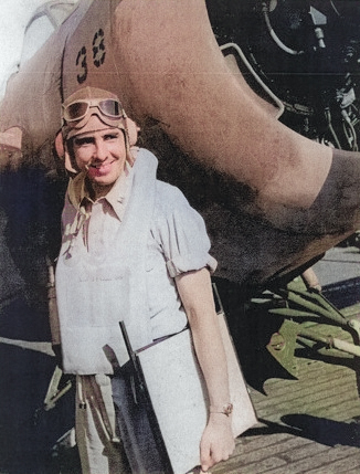 Lieutenant J. P. Weinel posing with a FM-1 Wildcat fighter aboard USS Coral Sea, 30 Oct 1943 [Colorized by WW2DB]