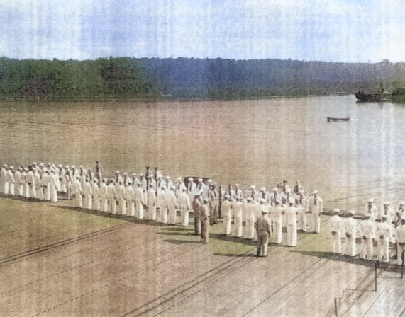 Captain Paul W. Watson of USS Coral Sea inspecting the A Division on the flight deck, 27 May 1944 [Colorized by WW2DB]