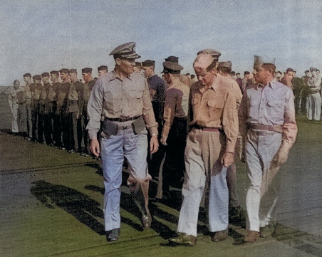 Captain George C. Montgomery inspecting USS Anzio, 16 Dec 1944, photo 1 of 2 [Colorized by WW2DB]