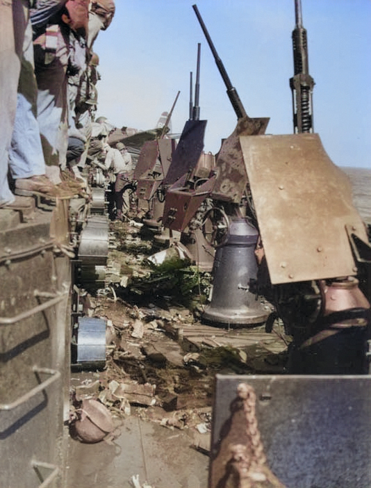 Special attack damaged USS Essex, late Nov 1944; note Oerlikon cannon and ammunition cans [Colorized by WW2DB]