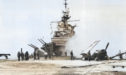Crewmen of USS Hancock assessing the damage caused by Japanese special attack aircraft, off Okinawa, Japan, 7 Apr 1945 [Colorized by WW2DB]