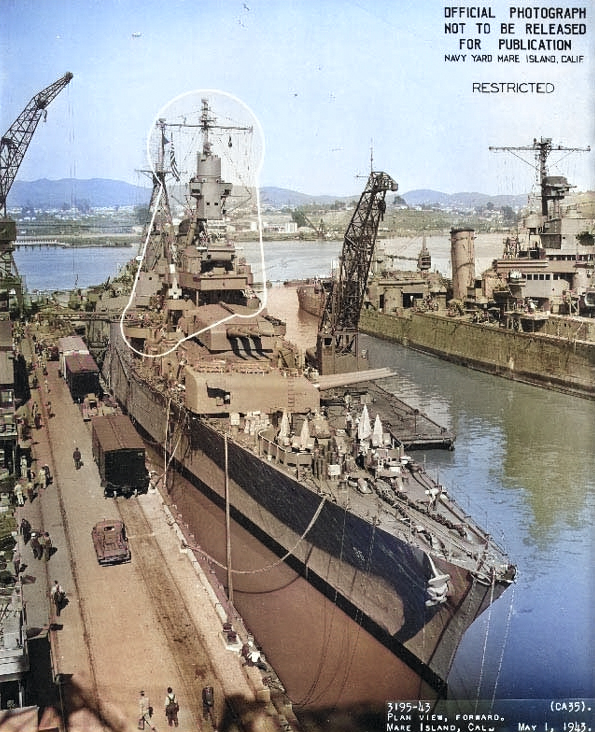 Indianapolis at Mare Island Navy Yard, California, view of her bow from starboard side, with heavy cruiser Minneapolis in background, 1 May 1943 [Colorized by WW2DB]