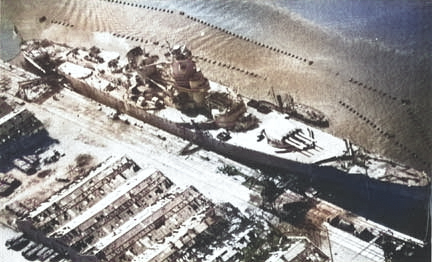 Jean Bart viewed from an aircraft of USS Ranger, Casablanca, French Morocco, 11 Nov 1942, photo 1 of 3 [Colorized by WW2DB]