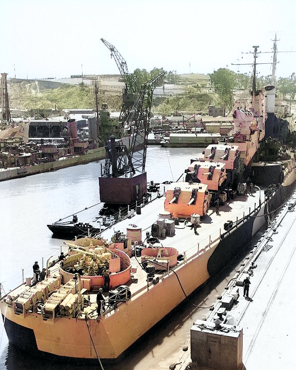 USS San Diego at Mare Island Naval Shipyard, Vallejo, California, United States, 9 Apr 1944; note camouflage Measure 33, Design 24d; USS Cassin in background [Colorized by WW2DB]