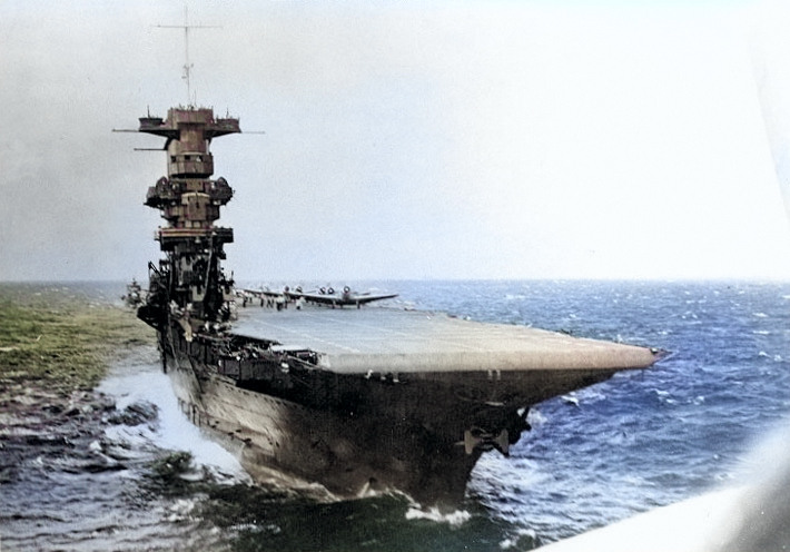 View of USS Saratoga from a TBD-1 Devastator aircraft which had just taken off from the flight deck, circa summer 1941 [Colorized by WW2DB]