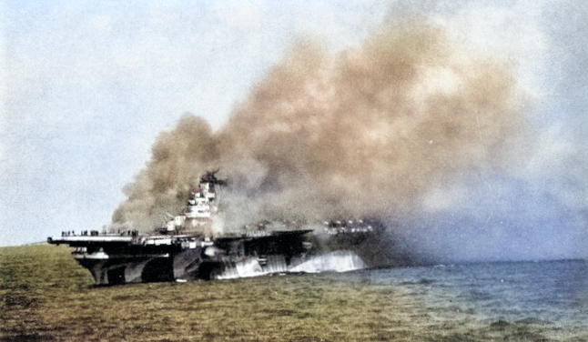 USS Ticonderoga burning after being hit by two special attack aircraft, 125 miles east-southeast of Taiwan, 21 Jan 1945 [Colorized by WW2DB]