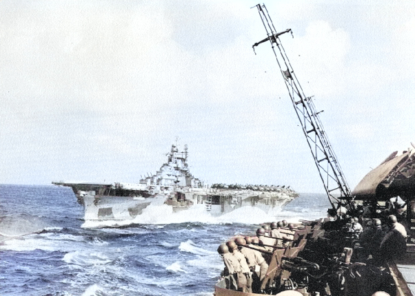 USS Yorktown (Essex-class) steaming in Task Group 58.4 en route to launch area off Kyushu, Japan, 19 Mar 1945. Photo likely taken from Intrepid with Langley behind Yorktown. Photo 1 of 2 [Colorized by WW2DB]