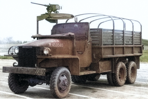 Studebaker US6 2 1/2-ton 6x6 transport truck, built to the same specifications as the GMC CCKW but in much fewer numbers, date unknown, photo 3 of 3; note open cab and optional gun ring mount [Colorized by WW2DB]