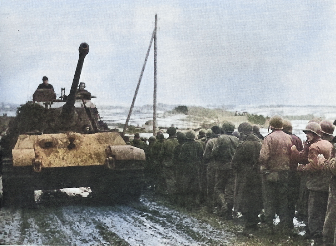 American prisoners of war being marched past a German Tiger II heavy tank, 1944 [Colorized by WW2DB]