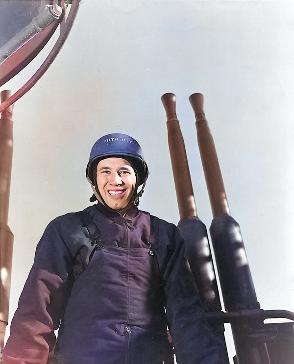 Bob Feller posing before a 40mm Bofors quad mount aboard a ship, possibly USS Alabama, 3 May 1943 [Colorized by WW2DB]