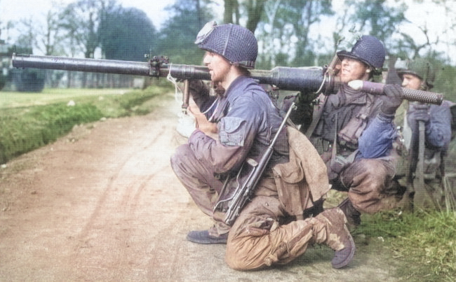 American Paratrooper with M3 knive, M1A1 carbine, and M18 recoilless gun, somewhere in Europe, 1944 [Colorized by WW2DB]