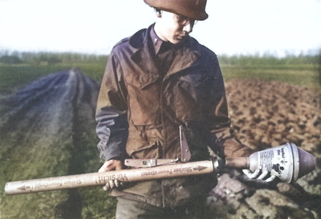 American soldier with a captured German Panzerfaust launcher, 1944-1945 [Colorized by WW2DB]