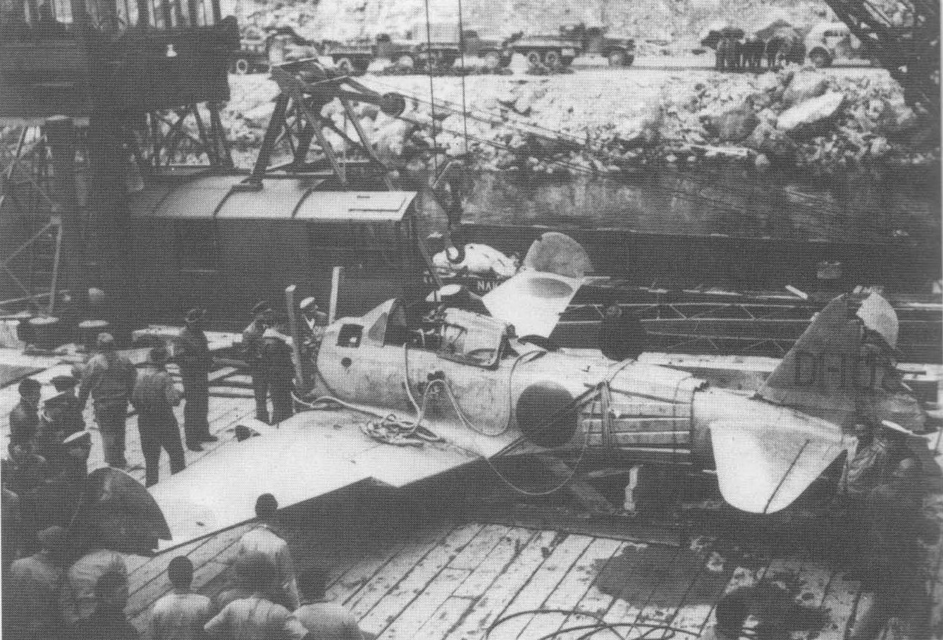 Captured A6M Zero fighter 'Akutan Zero' being loaded onto a ship bound for the continental United States, US Territory of Alaska, Jul 1942