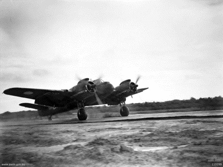 Beaufighter aircraft of No. 31 Squadron RAAF landing at an airfield on Tarakan Island off Borneo, 28 Jun 1945