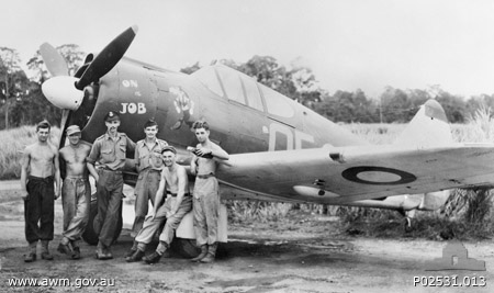 No. 4 Squadron RAAF pilots posing in front of Boomerang aircraft 'On the Job', Nadzab, New Guinea, 5 Oct 1943; L to R: Black, Brough, David Murrie, Philip Simpson, Chambers, and Rayson