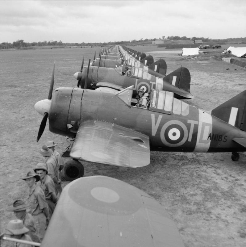 Buffalo Mark I fighters of No. 453 Squadron RAF at Sembawang, Singapore lined up in preparation of an inspection by Air Vice Marshal C. W. H. Pulford, Nov 1941