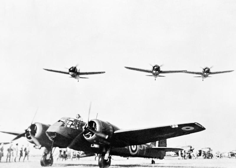 Blenheim Mark I bomber of No. 62 Squadron RAF and Buffalo fighters of Nos. 21 and 453 Squadrons RAAF on the ground, Sembawang, Singapore, late 1941, photo 2 of 2