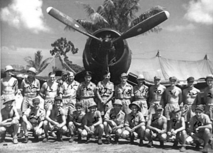 Officers and men of No. 3 Servicing Unit Headquarters of Royal New Zealand Air Force posing with a F4U-1 Corsair fighter, Green Island (now Nissan Island), 21 Dec 1944