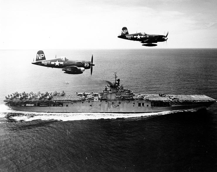 Two F4U-5N Corsair nightfighters of US Navy squadron VC-3 in flight over USS Boxer, off Korea, 4 Sep 1951; they were flown by Lt John Ely and Lt (jg) Stranlund