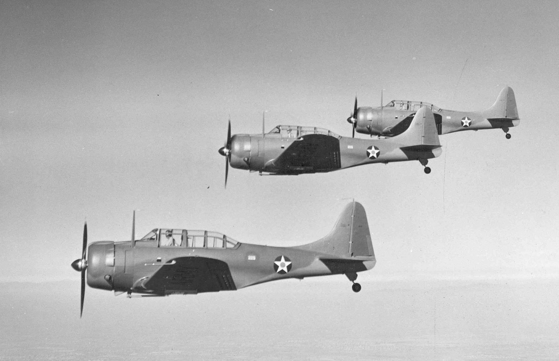 Three Douglas A-24 Banshee aircraft flying in formation, 1941-42