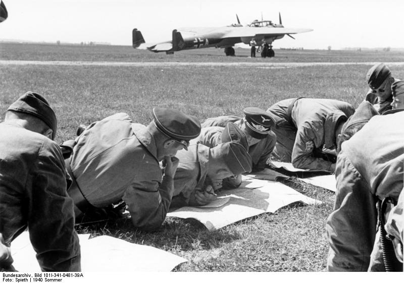 German bomber crew studying maps near their Do 17 bomber, western France, summer 1940