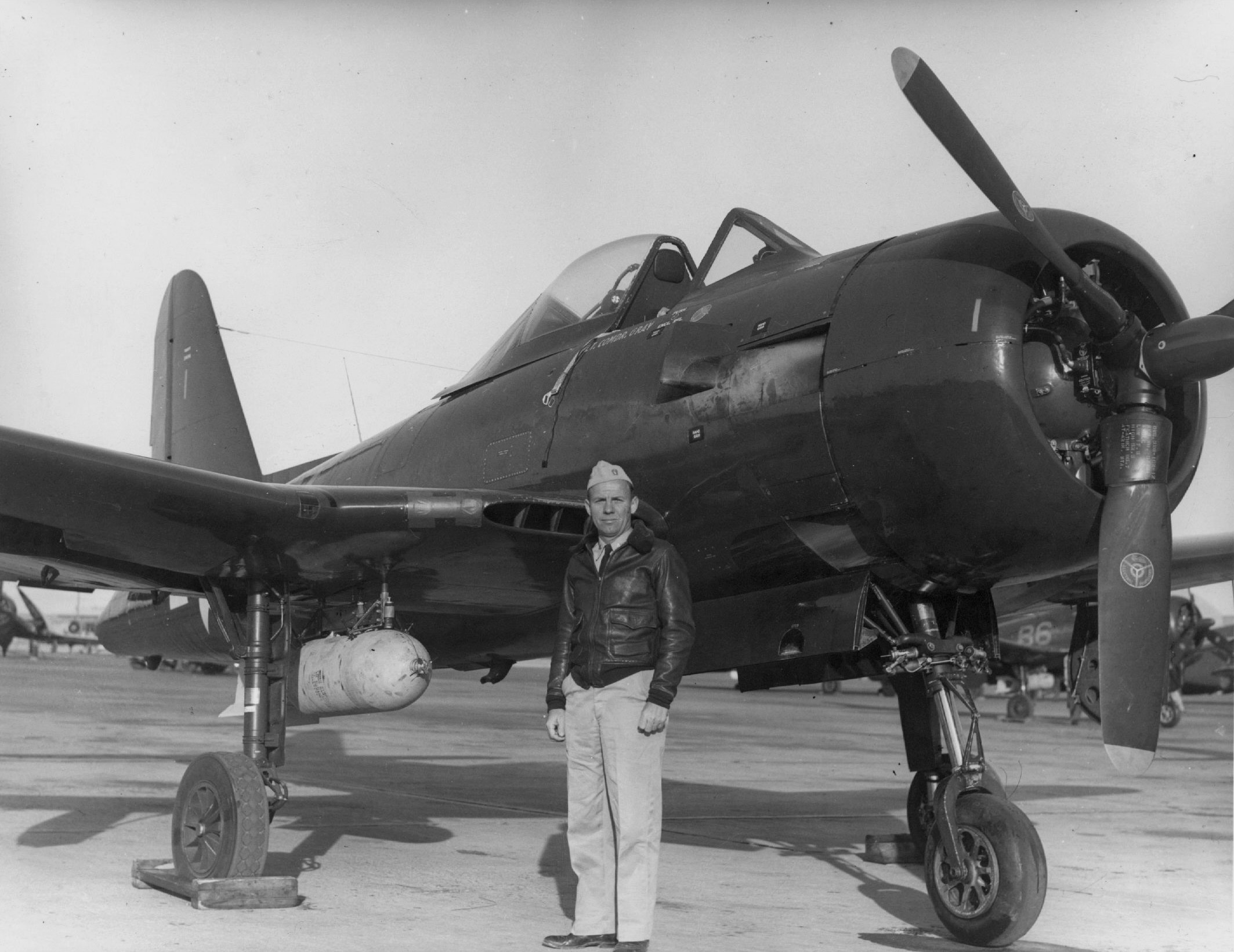US Navy squadron VF-66 commanding officer Lieutenant Commander John Gray posing with a FR-1 Fireball fighter, Naval Air Station North Island, California, United States, 1945