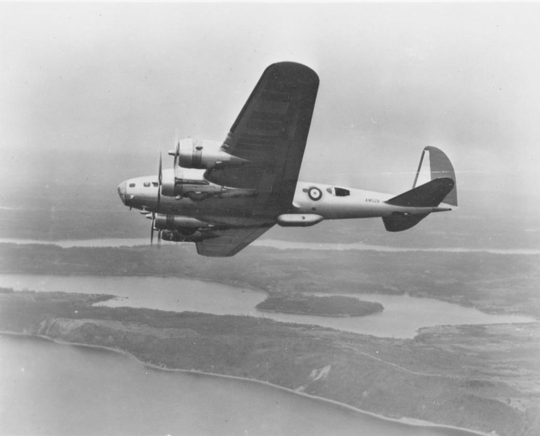 B-17C Fortress I bomber in British Royal Air Force markings in flight over Puget Sound, Washington, United States, 8 Nov 1941; note Vashon and Maury Islands in background