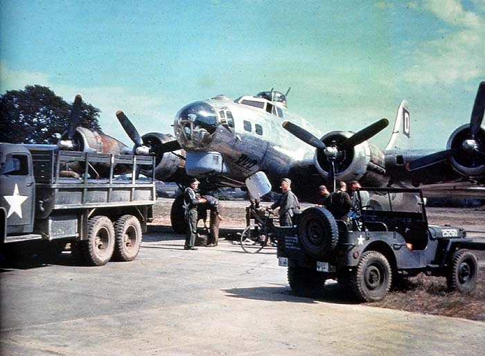 B-17G Flying Fortress bomber of the US 100th Bomber Group at RAF Thorpe Abbotts, Norfolk, England, United Kingdom, 1944; note Studebaker US6 truck and Jeep
