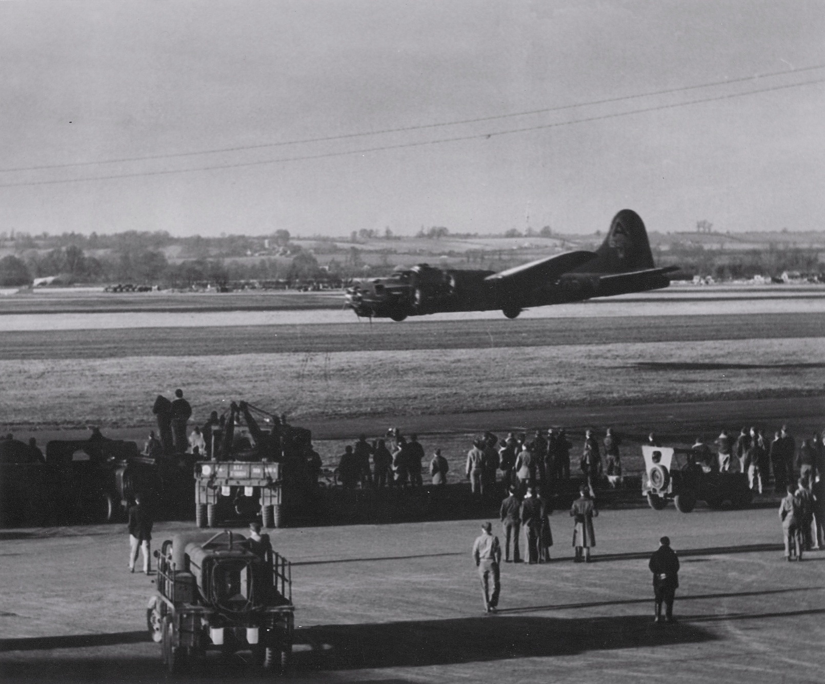 B-17F Fortress aircraft of the 91st BG, 8th Air Force executing a low fly-over during a demonstration at Bassingbourn, England, United Kingdom, 1943, photo 1 of 2