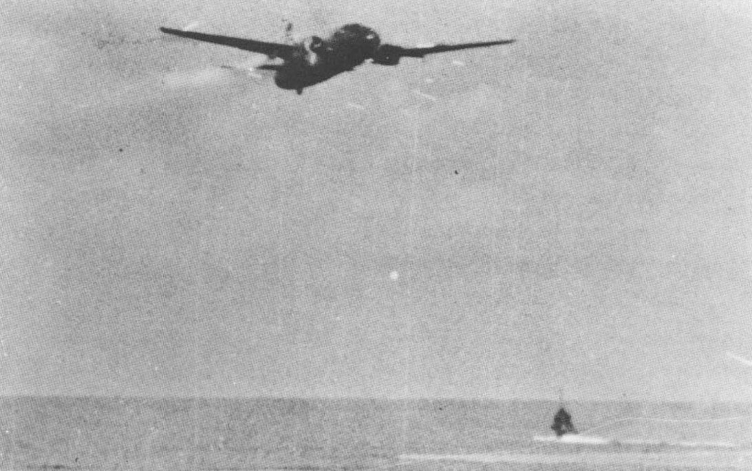 G4M1 bomber of Japanese Navy 4th Air Group commander Lieutenant Masayoshi Nakagawa, moments before crashing into sea during attack on USS Lexington off Bougainville, Solomon Islands, 20 Feb 1942. Photo 1 of 2