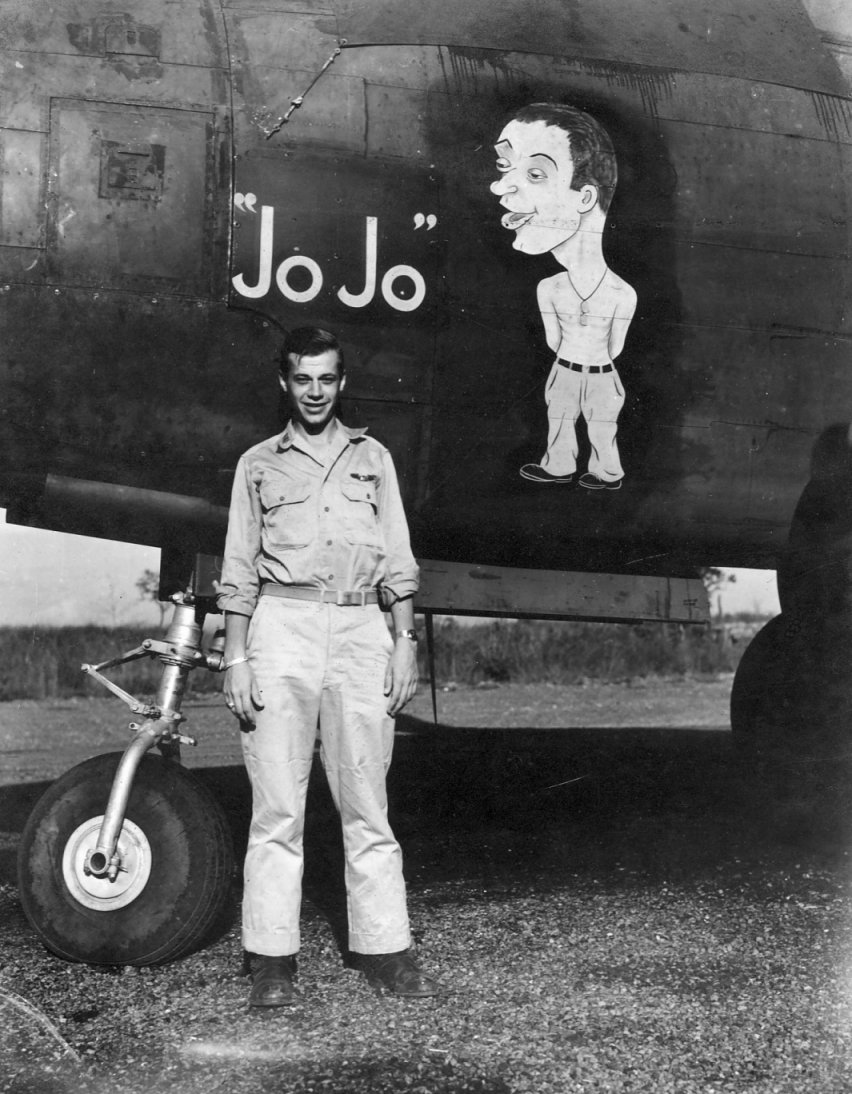 USAAF 3rd Bomb Group airman posing alongside of the nose art of A-20 Havoc aircraft 'Jo Jo', Nadzab Airfield, Australian New Guinea, early 1944